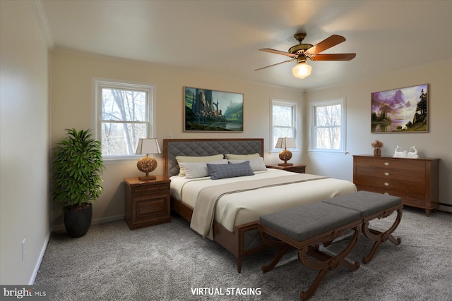 carpeted bedroom with ornamental molding and ceiling fan