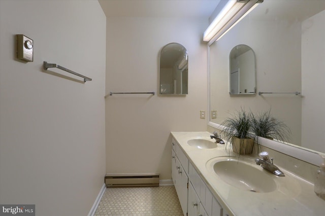 bathroom with vanity and baseboard heating