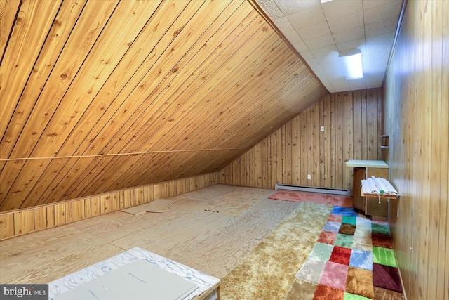 bonus room featuring lofted ceiling, a baseboard radiator, and wood walls