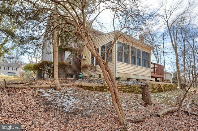 view of home's exterior featuring a sunroom