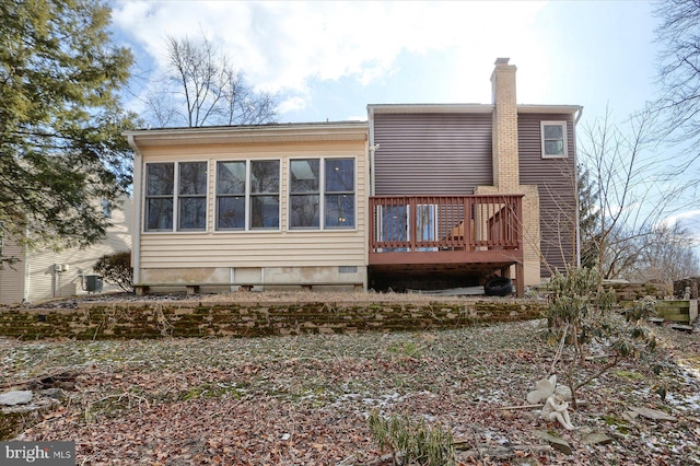 back of property featuring a deck