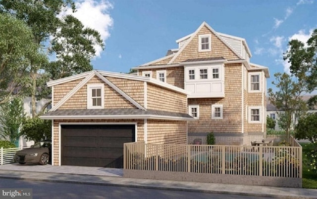 view of front of property with a garage