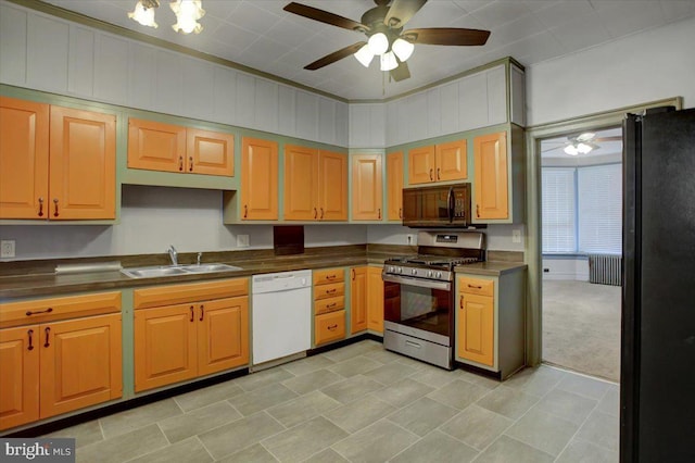 kitchen featuring sink, ceiling fan, radiator heating unit, light colored carpet, and black appliances