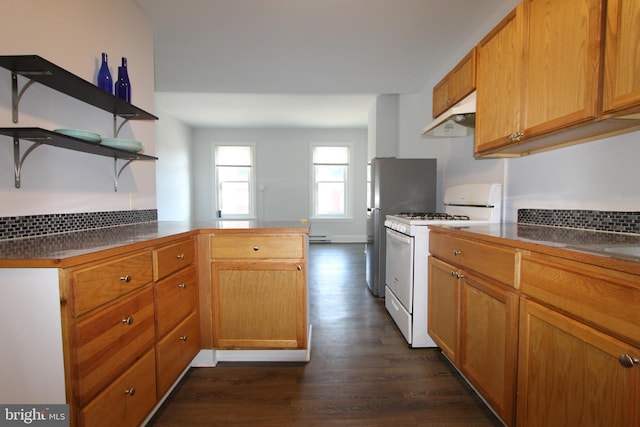 kitchen with under cabinet range hood, open shelves, dark countertops, and white gas range oven