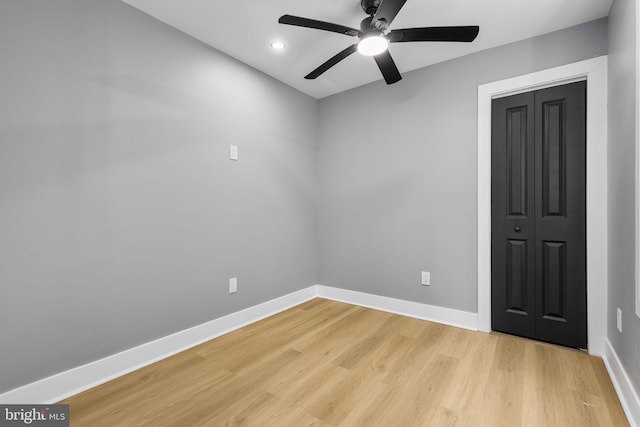 unfurnished room with ceiling fan and light hardwood / wood-style floors