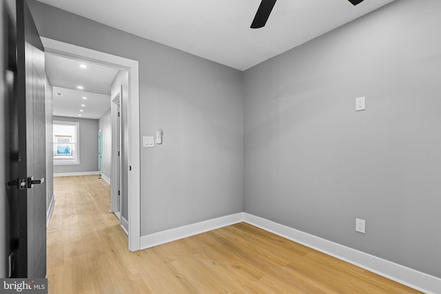 spare room featuring ceiling fan and light hardwood / wood-style floors