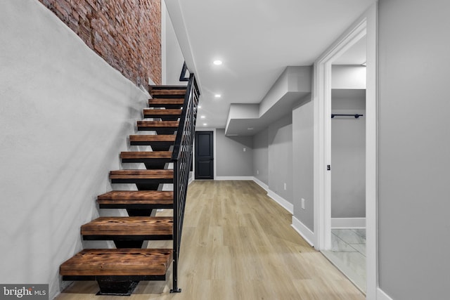 stairs with hardwood / wood-style floors