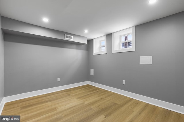 basement featuring light hardwood / wood-style flooring