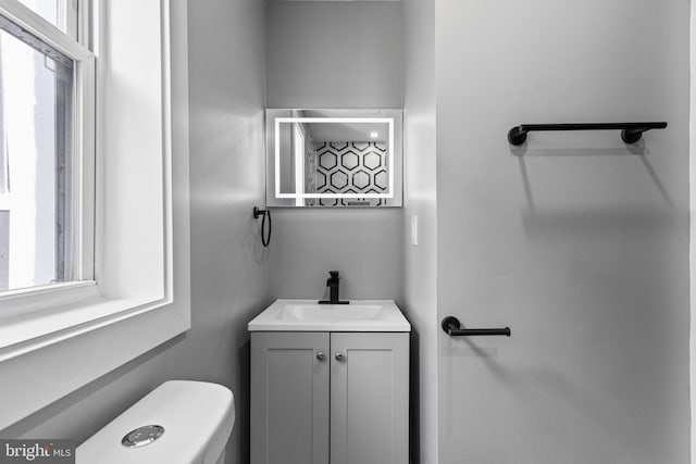 bathroom with vanity and toilet