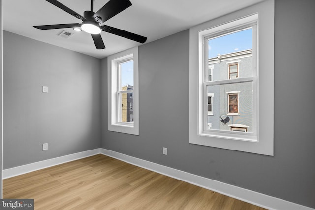 spare room featuring ceiling fan and light wood-type flooring