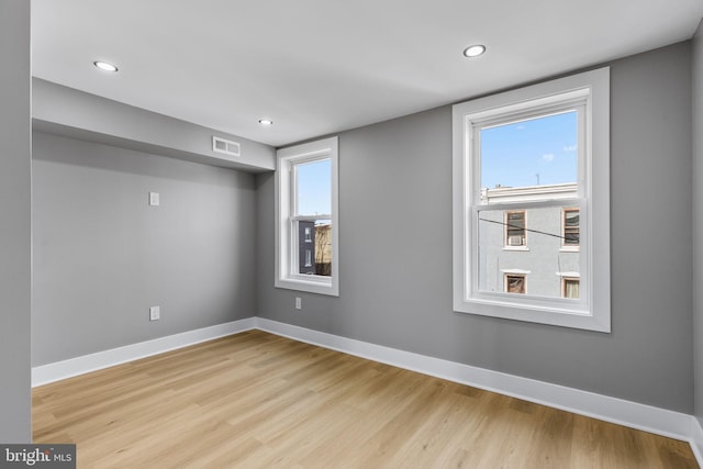 spare room featuring light wood-type flooring