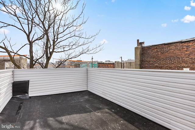 view of patio featuring a balcony