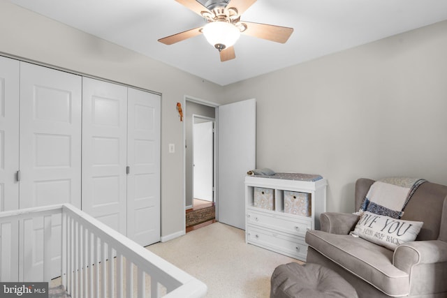 living area featuring ceiling fan and light carpet