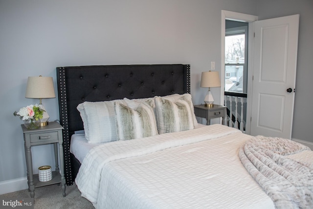 bedroom featuring light carpet