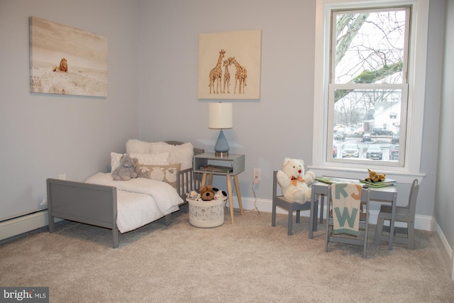 bedroom featuring a baseboard heating unit and carpet