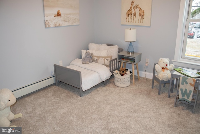 carpeted bedroom with baseboard heating and multiple windows