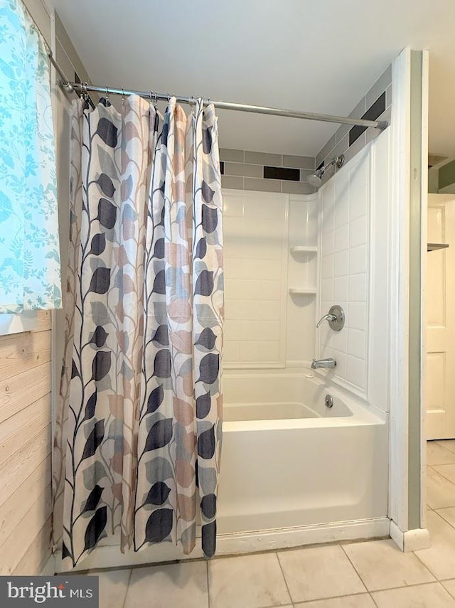 bathroom featuring shower / tub combo and tile patterned flooring