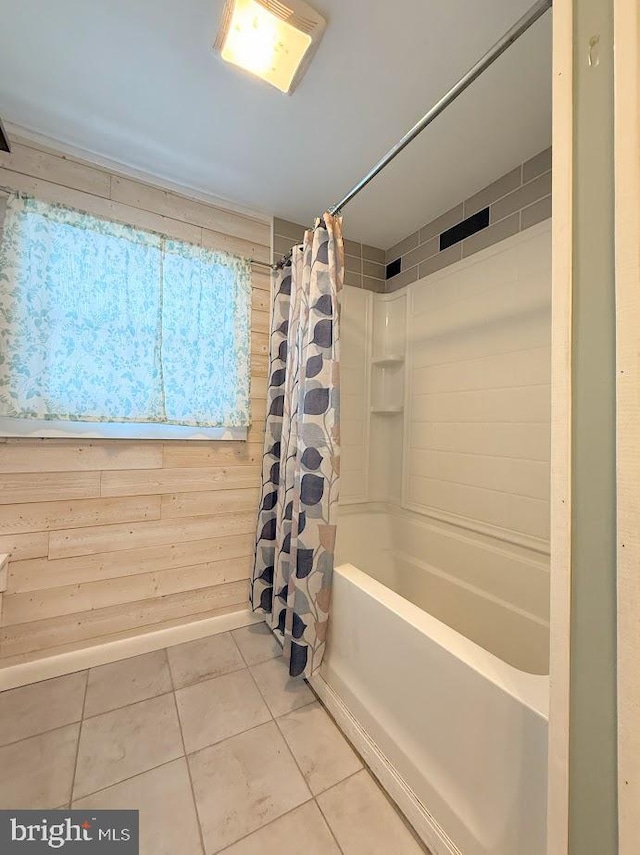 bathroom featuring shower / tub combo with curtain, tile patterned floors, and wood walls