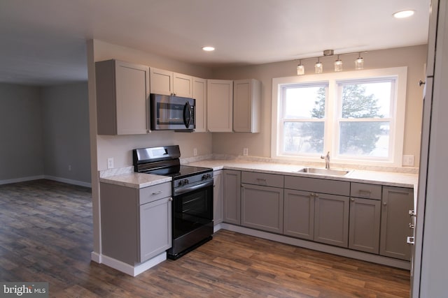 kitchen featuring stainless steel appliances, sink, and gray cabinets