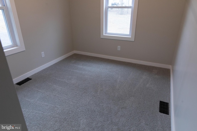 unfurnished room with carpet flooring