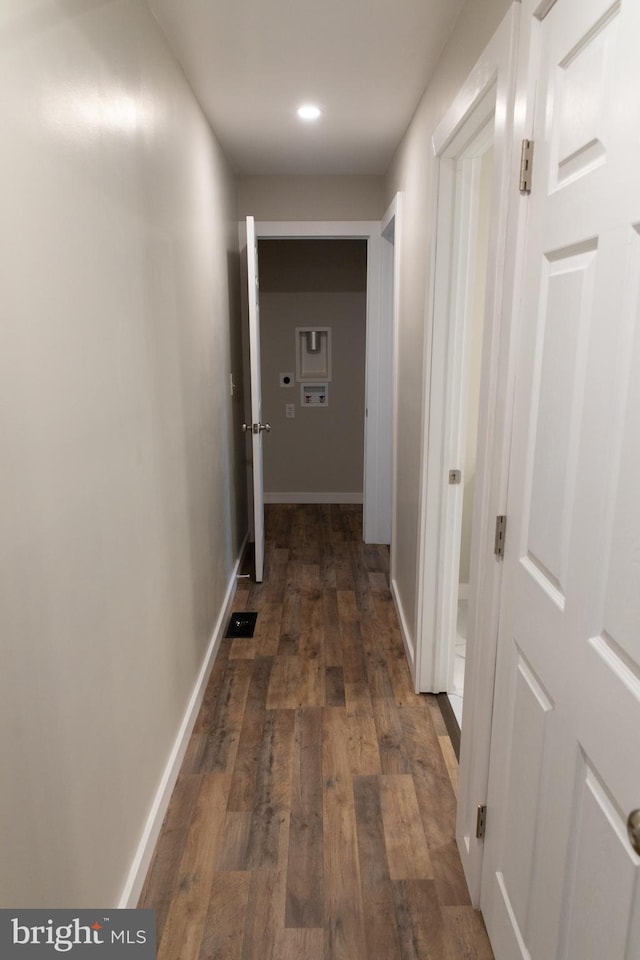 hallway featuring dark hardwood / wood-style floors