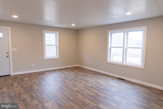 entryway with dark hardwood / wood-style floors