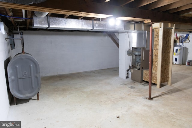 basement with electric water heater and heating unit