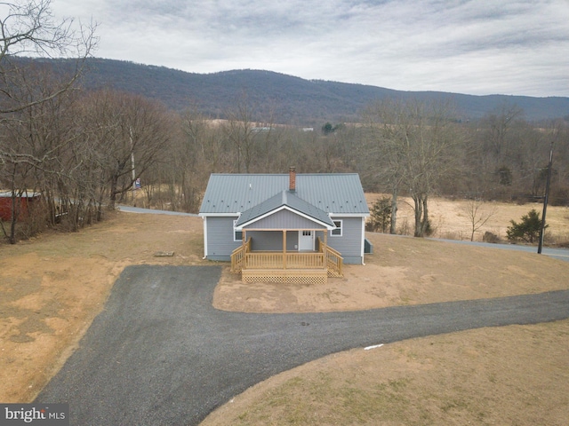 view of front of house featuring a mountain view and covered porch