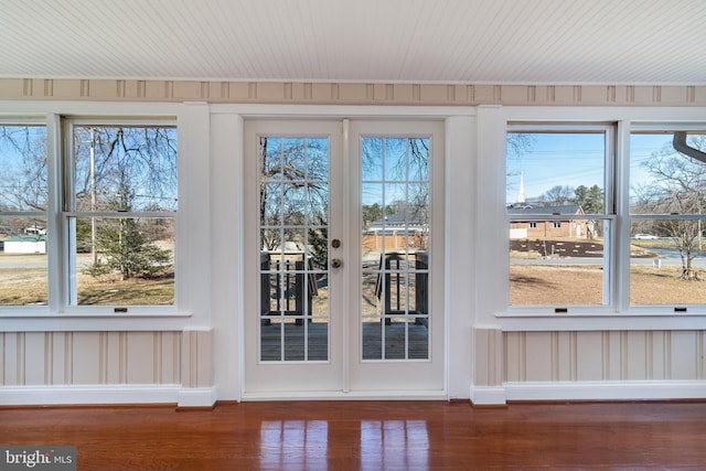 entryway featuring a healthy amount of sunlight, french doors, baseboards, and wood finished floors