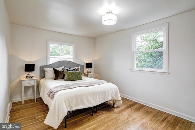 bedroom with light hardwood / wood-style flooring