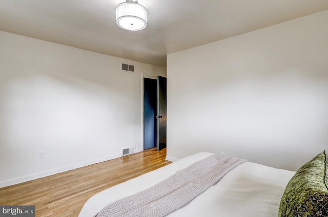 bedroom featuring hardwood / wood-style floors