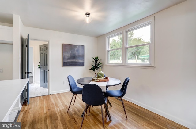 dining area featuring light wood-type flooring