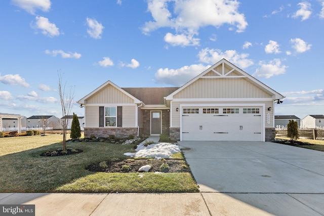 craftsman house featuring a garage and a front yard