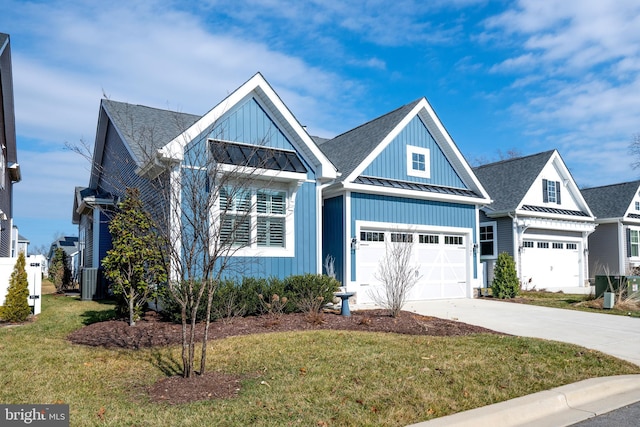 view of front facade with a garage and a front lawn