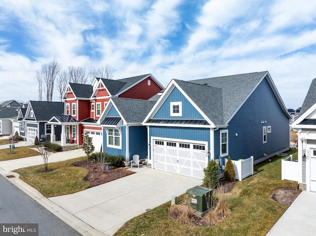 craftsman house featuring a garage and a front lawn