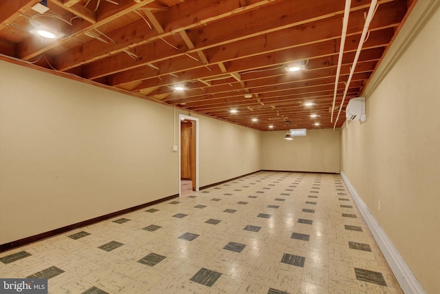 basement with a wall mounted air conditioner