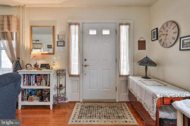 entryway with hardwood / wood-style floors