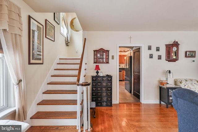 stairway featuring hardwood / wood-style floors