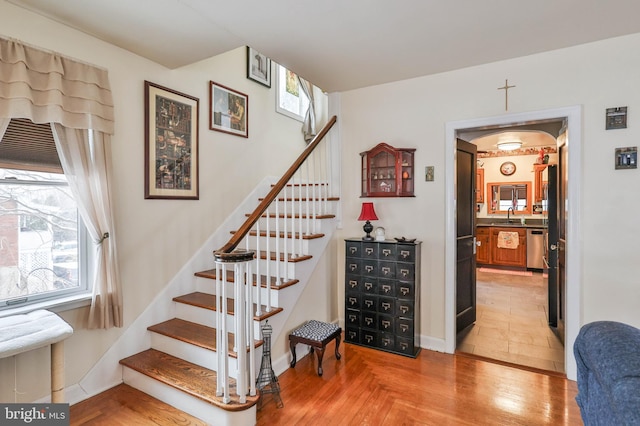 stairway featuring sink