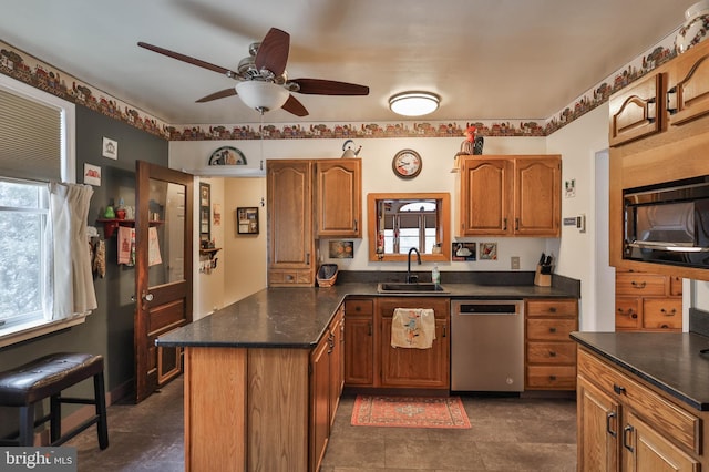 kitchen featuring ceiling fan, dishwasher, sink, and black microwave