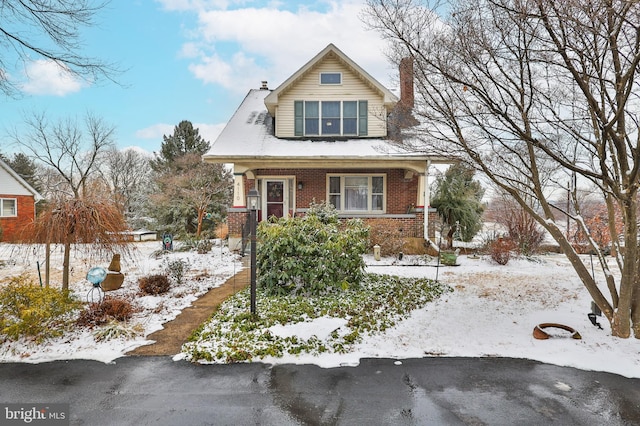 view of front of property featuring covered porch