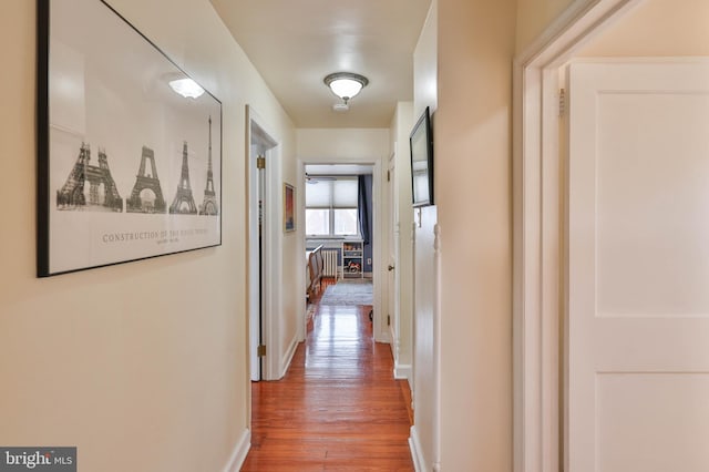 corridor featuring hardwood / wood-style floors