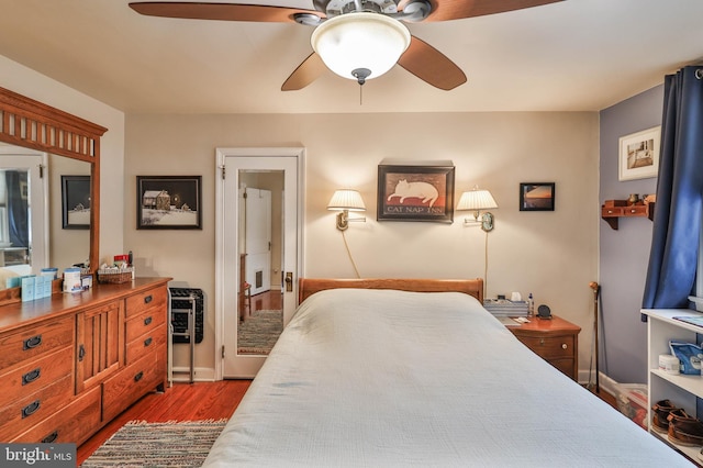 bedroom with ceiling fan and wood-type flooring