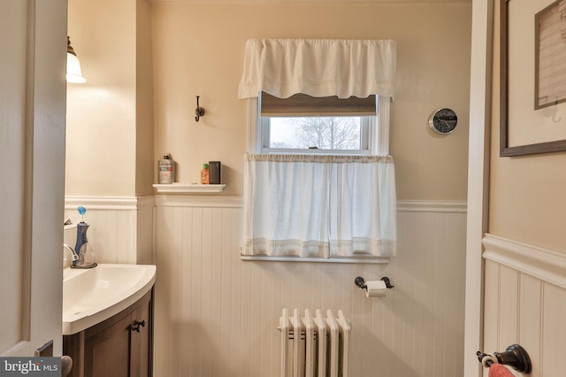 bathroom featuring vanity and radiator heating unit