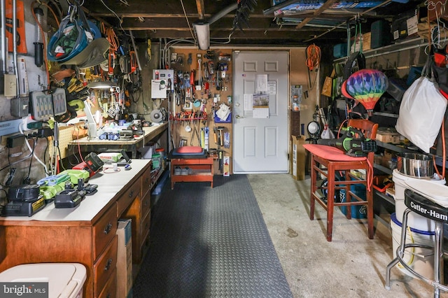 misc room featuring concrete floors and a workshop area