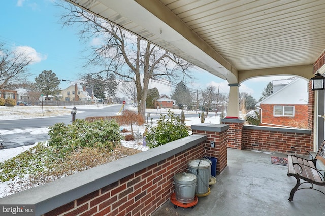 view of snow covered patio