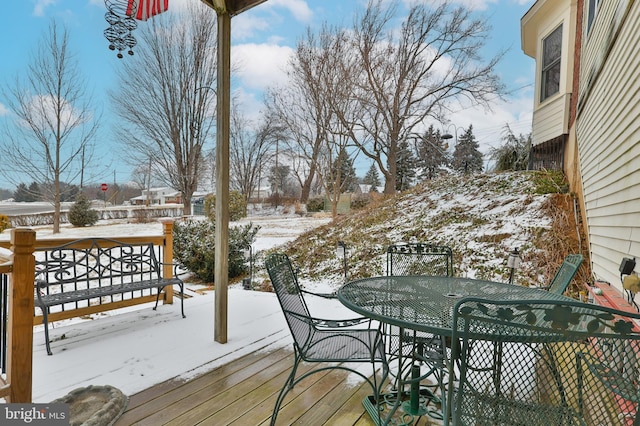 view of snow covered deck