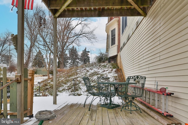 view of snow covered deck