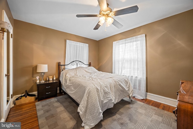 bedroom featuring dark hardwood / wood-style floors and ceiling fan