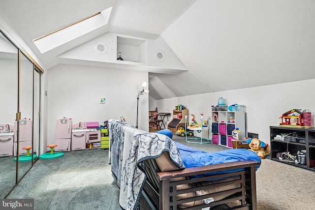 bedroom with carpet and vaulted ceiling with skylight